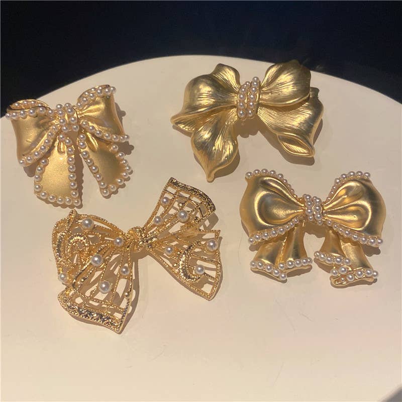 Gold-tone pearl bow brooch