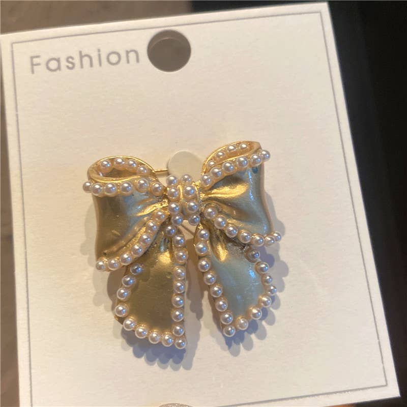 Gold-tone pearl bow brooch