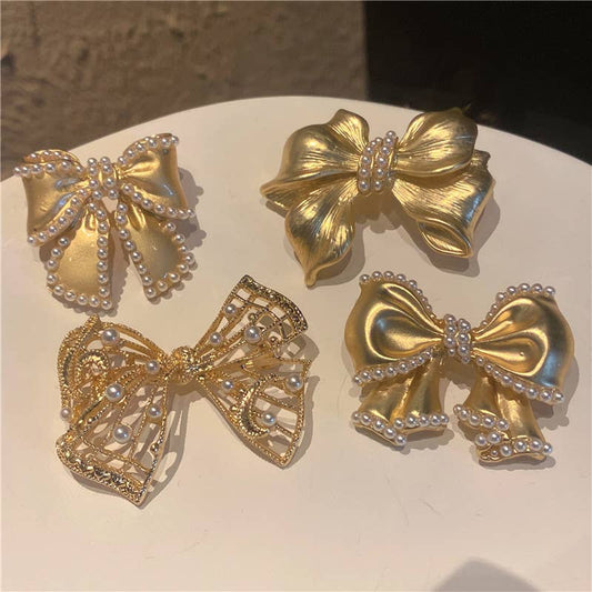 Gold-tone pearl bow brooch